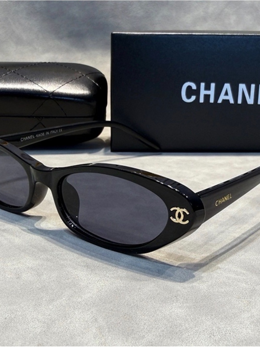 CHANEL Black Oval Logo Sunglasses with Gold CC Emblem
